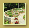 Stone walls encircle a terraced flower bed