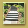 Granite stairs lend a formal air to the backyard