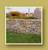 Retaining wall with Juniper plantings and mountain view